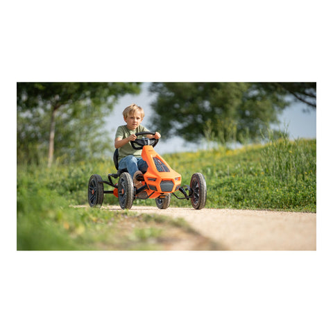 Child riding a BERG Rally NRG Orange pedal kart