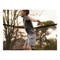 Child using a North trampoline safety enclosure